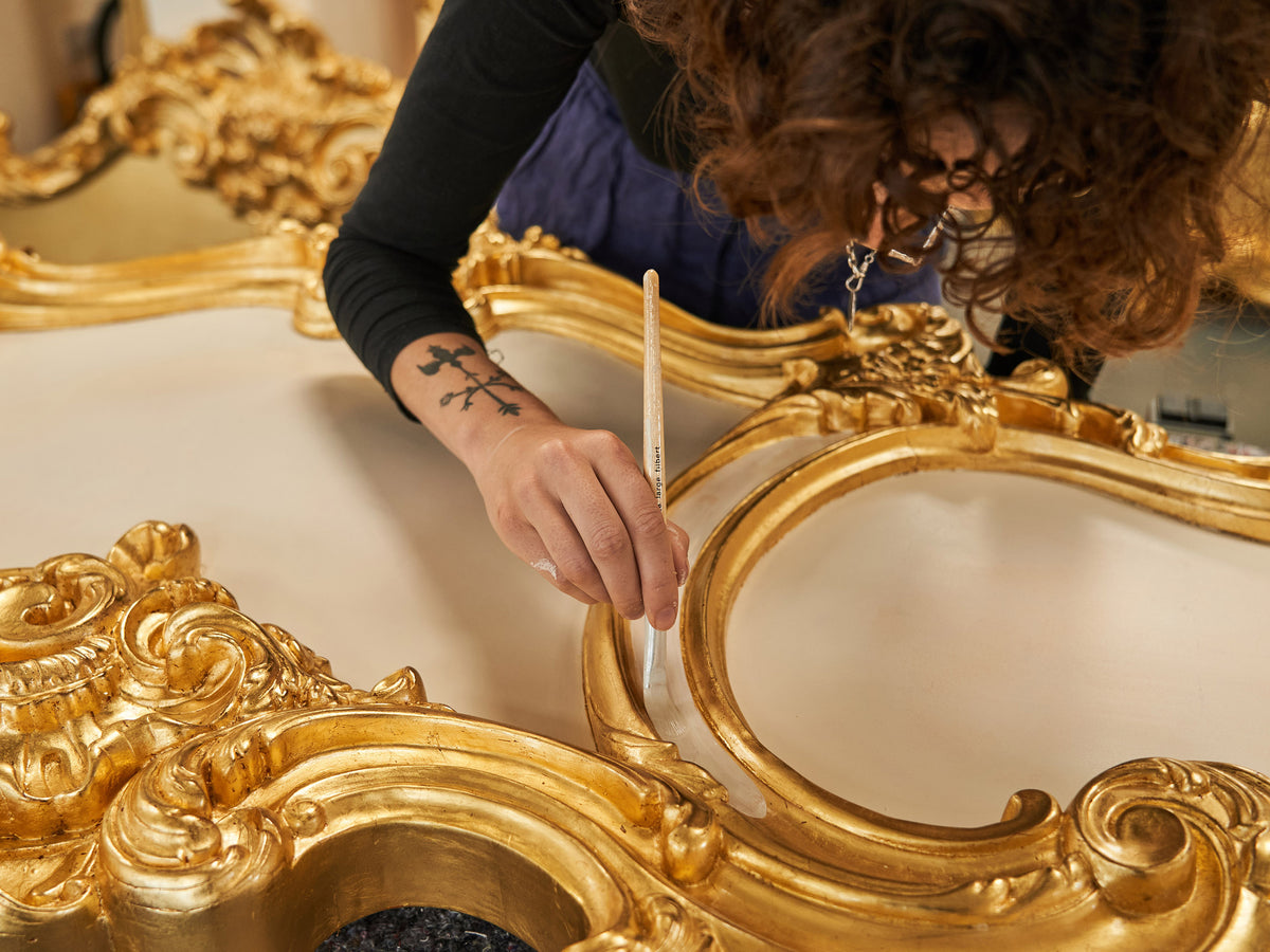 Laying gold leaf on a mirror frame