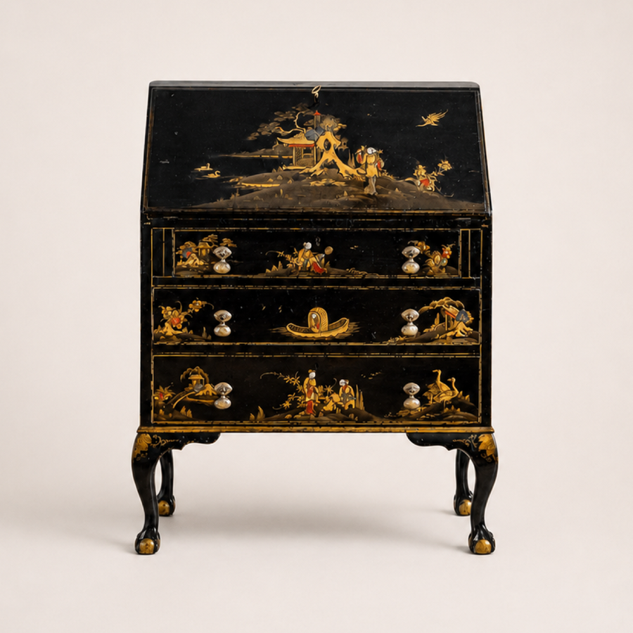 Early 20th-century black japanned gilt chinoiserie bureau, front view on a neutral studio background